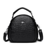 Round pattern croc curve designer bag