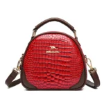 Round pattern bright leather handbag