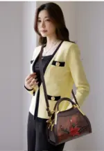 Lotus handbag carried with detachable shoulder strap