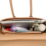 Structured pocket satchel holding everyday essentials