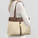 Canvas work tote carried on shoulder