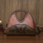 Floral Embossed Half-Moon Handbag in brown