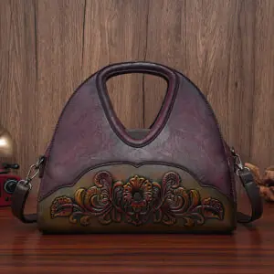 Floral Embossed Half-Moon Handbag in burgundy